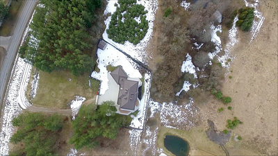 Vertical Flight Over House With Rotation